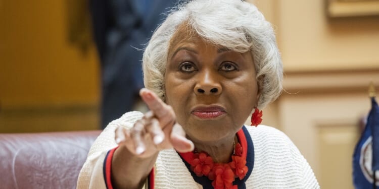 Sen. L. Louise Lucas points toward a camera.