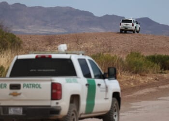 Border Patrol vehicles are pictured along the fence at the U.S. border with Mexico, in Douglas, Arizona, in an April 2025 file photo.