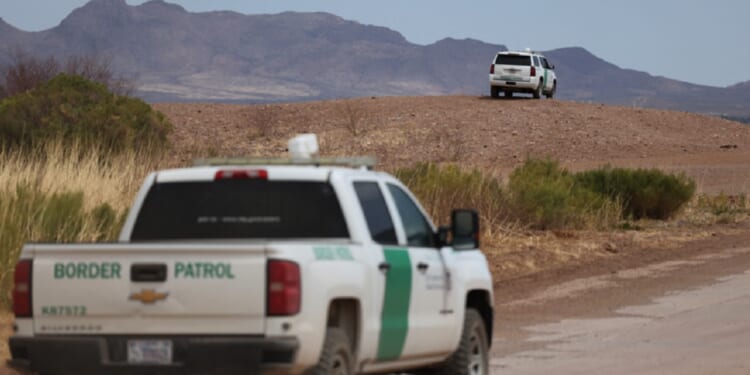 Border Patrol vehicles are pictured along the fence at the U.S. border with Mexico, in Douglas, Arizona, in an April 2025 file photo.