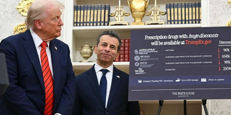 President Donald Trump is pictured with Food and Drugs Commissioner Marty Makary in a file photo dated Oct. 10.