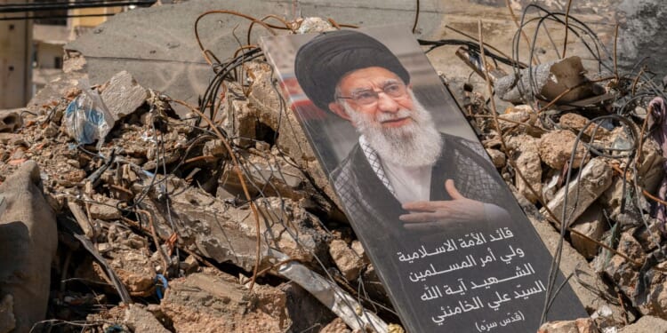 A portrait of Iran's former supreme leader, the now-deceased Ayatollah Ali Khamenei, sits on a pile of debris in the southern suburb of Dahieh, Lebanon on May 6, 2026.