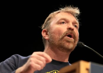 Democratic Senate candidate Graham Platner speaks at a “Fighting Oligarchy” tour stop held by Sen. Bernie Sanders at the Collins Center for the Arts on the University of Maine campus on May 24, 2026, in Orono, Maine.