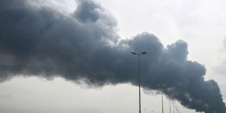 Smoke rises from near the Kuwait International Airport after a reported drone strike on March 25, 2026.