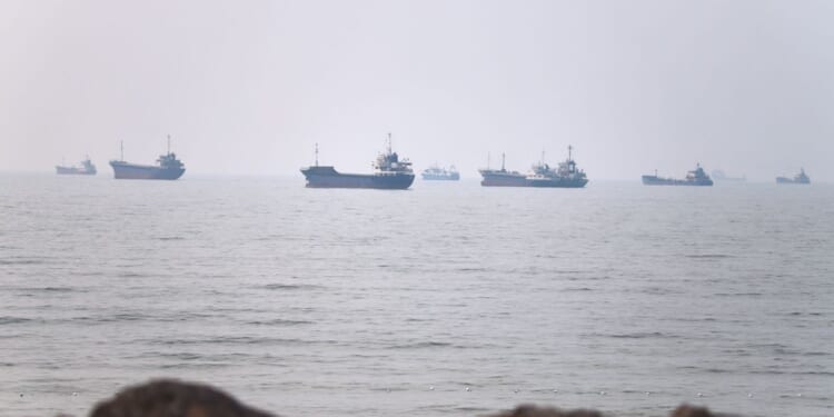 Tanker caught fire after being struck by a projectile in the Strait of Hormuz