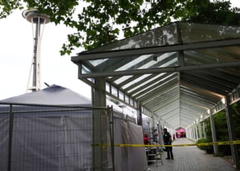 Shooting at a Seattle food festival leaves 2 dead and wounds 5, fire official says