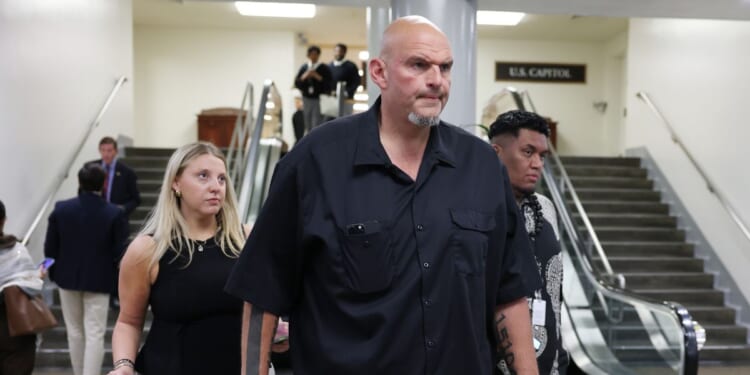 Sen. John Fetterman walks through the Senate Subway during a vote in the U.S. Capitol Building on Oct. 1, 2025, in Washington, D.C.