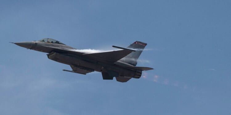 An F-16 fighter jet flies during an exhibition over Las Palmas air base in Lima, Peru, on April 23, 2026.