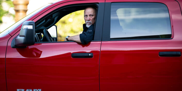 Rep. Chip Roy of Texas arrives in a red pickup truck for votes in the U.S. House.