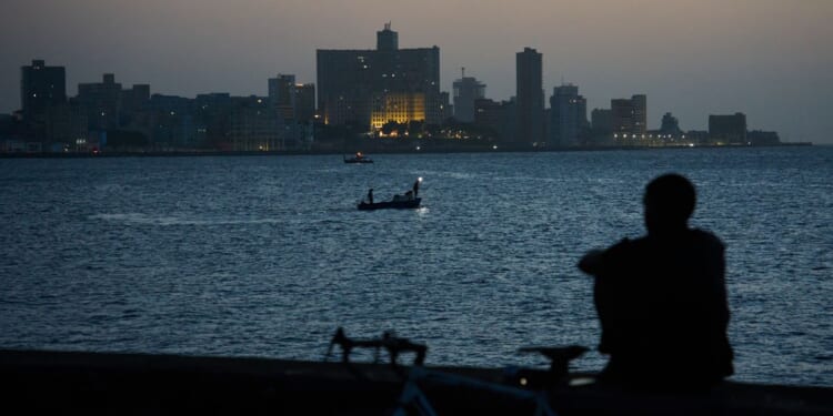 Cubans sleep on seaside boardwalk to seek relief from crippling blackouts and summer heat