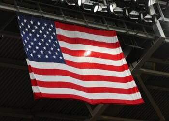 The American flag flies below black roof scaffolding on July 25, 2026 in Houston, Texas.