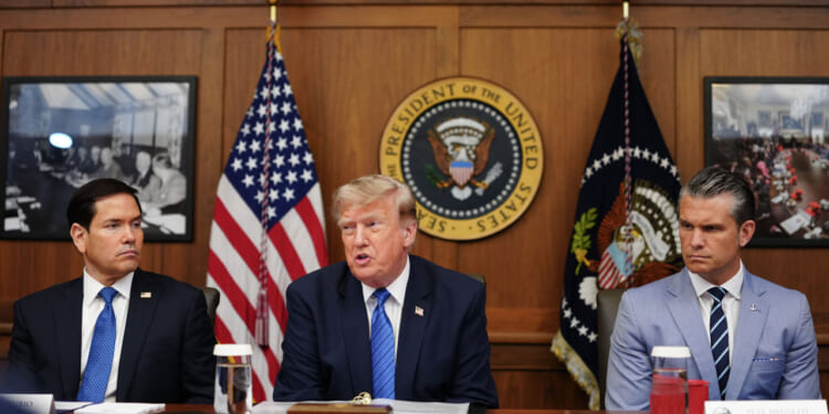 US President Donald Trump, alongside Secretary of State Marco Rubio (L) and Secretary of Defense Pete Hegseth (R), speaks during a Cabinet meeting at Camp David in Maryland, on July 31, 2026.