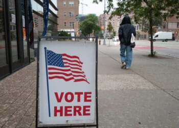 A sign marks the location of a polling place as residents vote in the state's primary election on Aug. 11, 2026, in Madison, Wisconsin.