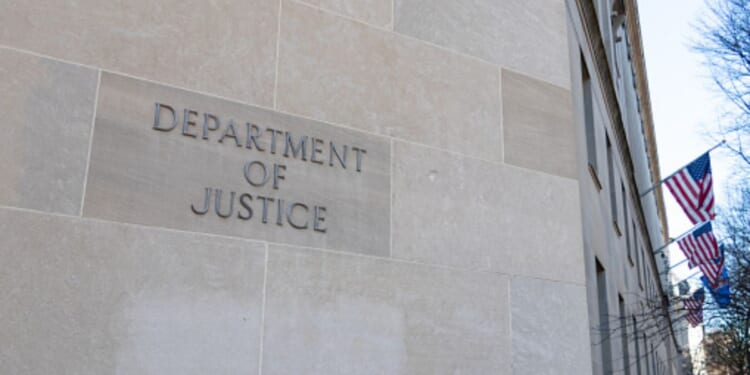 The DoJ Building is pictured on a bright sunny day.