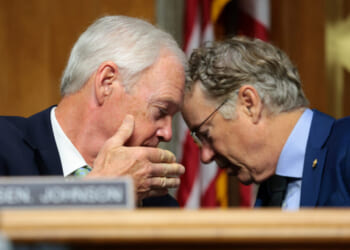 U.S. Sen. Ron Johnson (R-WI) speaks to Chairman Sen. Rand Paul (R-KY) during a business meeting with the Senate Homeland Security Committee