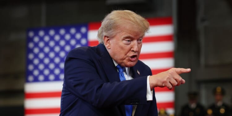 President Donald Trump arrives to deliver remarks at the David S. Mack Center for Training and Intelligence on Aug. 14, 2026, in Garden City, New York.