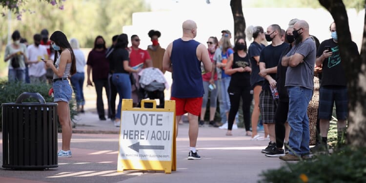 Voters wait in line at the Surprise Court House polling location in Maricopa County, Arizona, on Nov. 3, 2020.