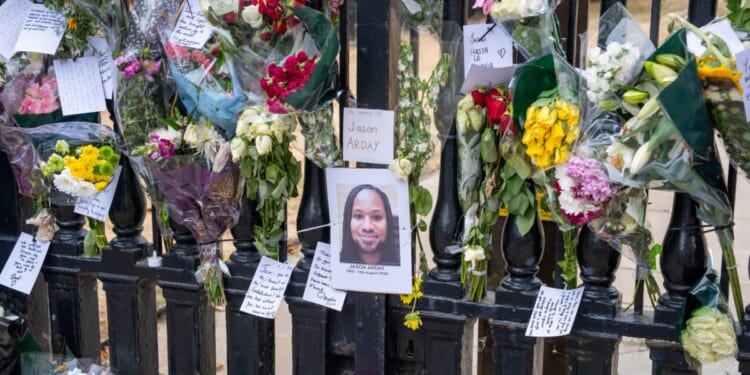 Flowers and cards placed by students and staff outside The Senate House on Aug. 17, 2026, in Cambridge, England.