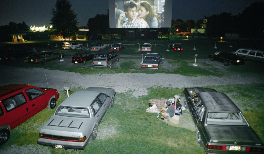 In this Aug. 10, 1993, file photo, cars form rows at dusk to enjoy movies in the open air at Shankweiler's Drive-In Theatre in Orefield, Pa. Billed as the nation's oldest operating drive-in movie theater, Shankweiler's opened in 1934 near Allentown, Pa., and marks its 83rd season in 2016. In much of the nation, drive-ins have gone the way of rotary dial phones, but in Pennsylvania, Ohio and New York, the numbers are holding steady. (AP Photo/Rusty Kennedy, File) **FILE**