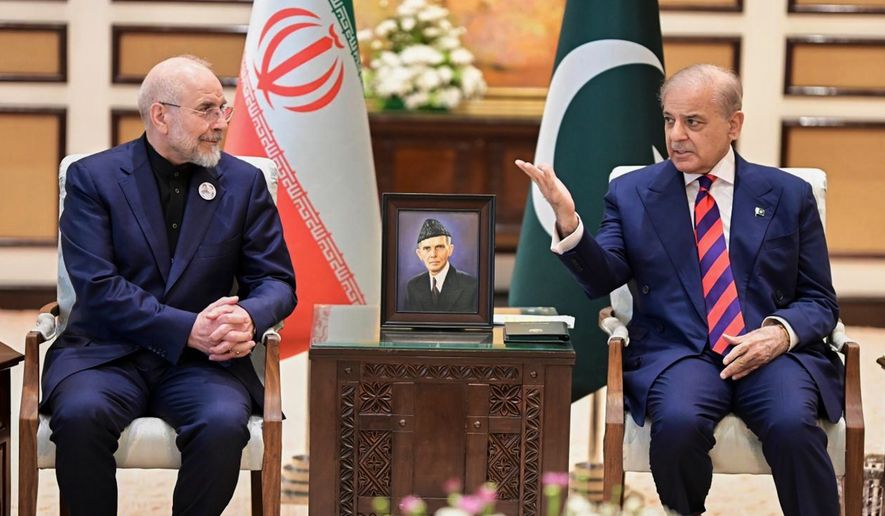 In this photo released by the Pakistan Prime Minister's Office, Iran's parliament Speaker Mohammad Bagher Ghalibaf, left, meets with hand with Pakistani Prime Minister Shehbaz Sharif, in Islamabad, Pakistan, Saturday, April 11, 2026. (Pakistan Prime Minister's Office via AP) ** FILE **