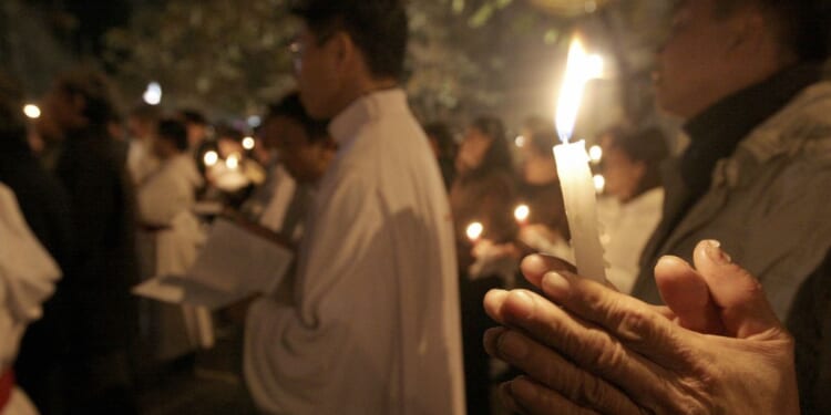 Vietnamese Catholic Christians pray in public in Hanoi, Vietnam, on Jan. 5, 2008.
