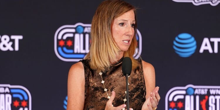 WNBA Commissioner Cathy Engelbert, seen in a July 25 photo, condemned "bad-faith efforts" of men who have put forth their names for the WNBA draft as efforts "to demean or marginalize" transgender athletes."