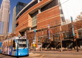 The electric light rail mass transit is seen driving through an empty city street on a sunny, but freezing cold winter day in Charlotte, North Carolina, on Dec. 16, 2025.