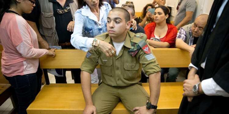 Israel's president pardons a combat medic whose shooting of a Palestinian attacker caused debate