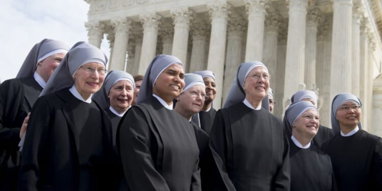 Loraine Marie Maguire, mother provincial of the Little Sisters of the Poor, stands alongside fellow nuns following oral arguments in seven cases dealing with religious organizations that want to ban contraceptives from their health insurance policies on religious grounds at the Supreme Court in Washington, D.C., on March 23, 2016.