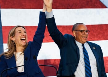 New Jersey Democratic Gov. Mikie Sherrill celebrates with Lt. Gov. Dale Caldwell after their win during an election night watch party at the Hilton East Brunswick Hotel on Nov. 4, 2025, in East Brunswick, New Jersey.