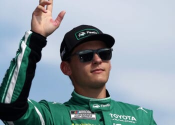 Corey Heim, driver of the Fleetio Toyota, waves to fans as he walks onstage during driver intros prior to the NASCAR Cup Series Cook Out Southern 500 at Darlington Raceway on Sept. 6, 2026, in Darlington, South Carolina.