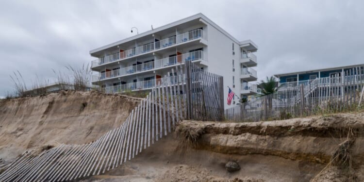 Fences and sand dunes lay in ruin along Ocean City Beach on Sept. 28, 2026, in Ocean City, Maryland.