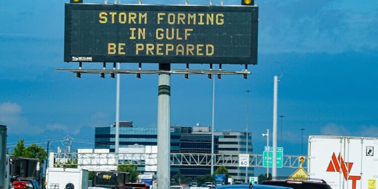 Tropical Depression Edouard unleashes heavy rain in Texas, knocking out power to thousands