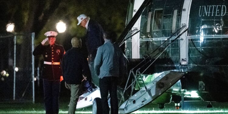 President Donald Trump exits a Marine One helicopter near the White House in Washington, DC after cutting his trip to Camp David suddenly short on Sept. 19, 2026.