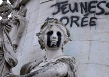 This photograph shows the "Egalite" statue with black tears and a graffiti reading "Golden Youth" in the "Monument a la Republique" at the Place de la Republique in Paris on Oct. 21, 2026.
