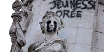 This photograph shows the "Egalite" statue with black tears and a graffiti reading "Golden Youth" in the "Monument a la Republique" at the Place de la Republique in Paris on Oct. 21, 2026.