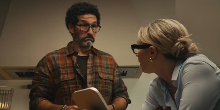 A dumb-looking man and a girlboss wife in a scene from Apple's ad for its new HomeView product.