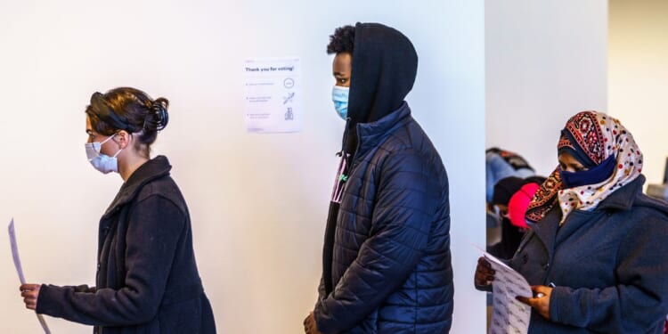 Residents vote at a polling station in Minneapolis, Minnesota, on Nov. 3, 2020.