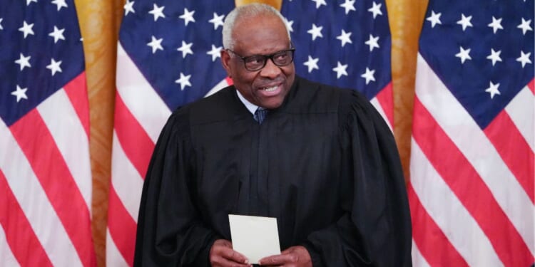 Supreme Court Justice Clarence Thomas looks on during a swearing in ceremony for new Chairman of the Federal Reserve Kevin Warsh in the East Room of the White House in Washington, D.C., on May 22, 2026.