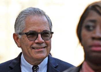 Philadelphia District Attorney Larry Krasner walks to court for a hearing over a lawsuit he filed against Elon Musk on Oct. 31, 2024, in Philadelphia, Pennsylvania.