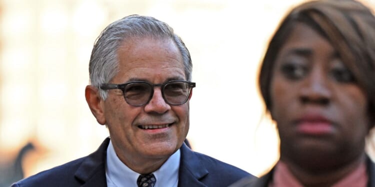 Philadelphia District Attorney Larry Krasner walks to court for a hearing over a lawsuit he filed against Elon Musk on Oct. 31, 2024, in Philadelphia, Pennsylvania.