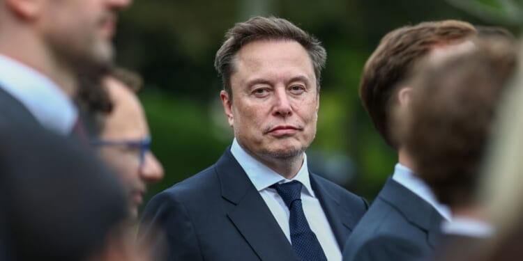 Tesla, SpaceX, and X CEO Elon Musk attends a press briefing held by President Donald Trump with AI executives following a meeting on artificial intelligence, outside the West Wing of the White House on Sept. 29, 2026, in Washington, D.C.