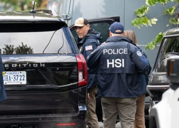 Homeland Security Investigations police search the Washington, D.C., home of Rep. Ilhan Omar, a Minnesota Democrat, Monday.