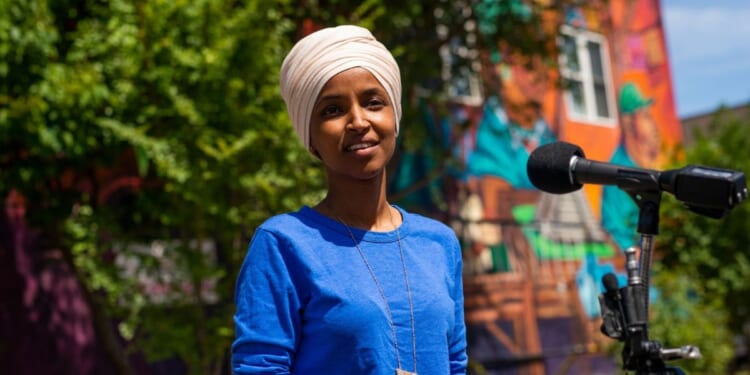 Rep. Ilhan Omar speaks with media gathered outside Mercado Central on Aug. 11, 2020, in Minneapolis, Minnesota.