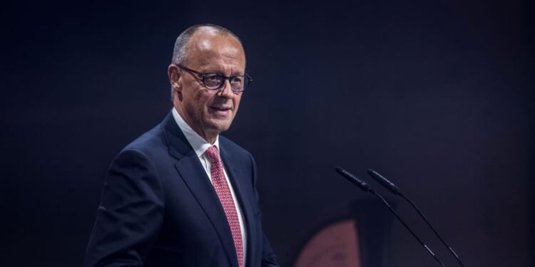 German Chancellor Friedrich Merz speaks on stage at the Invest in Germany Summit to announce a strategic cooperation between the German government, NVIDIA, and a group of German companies in artificial intelligence on Oct. 19, 2026, in Berlin, Germany.