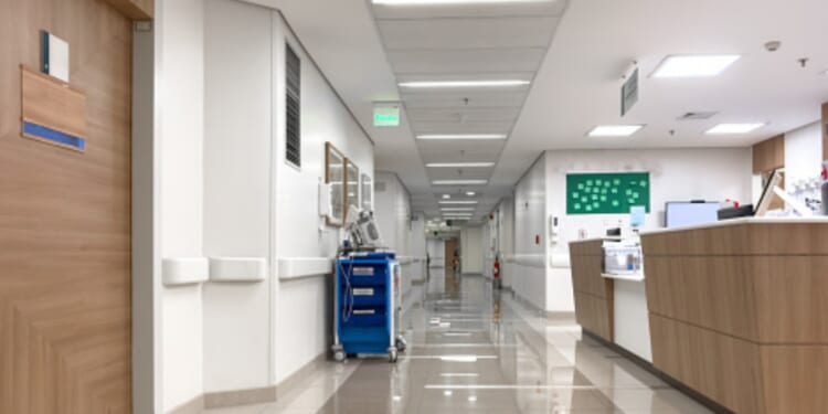 An empty hospital hallway is pictured.