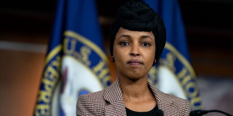 Rep. Ilhan Omar looks on during a news conference on reintroducing the Neighbors Not Enemies Act on Capitol Hill on Jan. 22, 2025, in Washington, D.C.