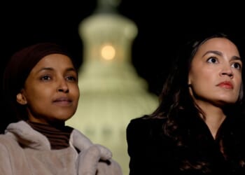 Rep. Ilhan Omar and Rep. Alexandria Ocasio-Cortez listen during a news conference calling for a ceasefire in Gaza outside the U.S. Capitol building on Nov. 13, 2023, in Washington, D.C.
