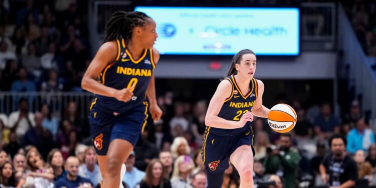 Caitlin Clark and Kelsey Mitchell of the Indiana Fever bring the ball up the floor against the Toronto Tempo during the first half in their WNBA game at Coca-Cola Coliseum on Sept. 18, 2026, in Toronto, Canada.