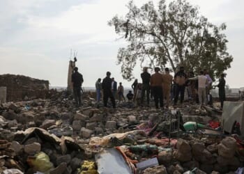 People inspect the damage Tuesday at a site targeted by airstrikes, carried out the night before by Jordan on the village of Al-Taf in the Al-Lajat region, located in the northeastern countryside of Daraa. Jordan said it had killed more than 20 Islamic State group jihadists in strikes on Syria in retaliation for a deadly attack on a church.