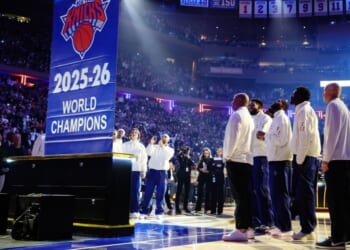 The New York Knicks look toward the team's new banner Tuesday after receiving their championship rings during the Ring Ceremony and Banner Raising to celebrate the New York Knicks' NBA Championship win ahead of the game against the Philadelphia 76ers at Madison Square Garden in New York City.